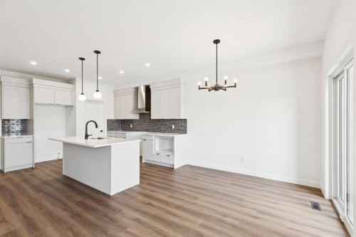 69 Heritage Park, Cochrane, AB - Indoor Photo Showing Kitchen With Upgraded Kitchen