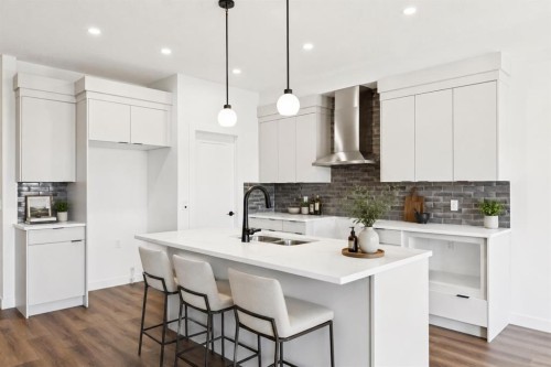 69 Heritage Park, Cochrane, AB - Indoor Photo Showing Kitchen With Double Sink With Upgraded Kitchen