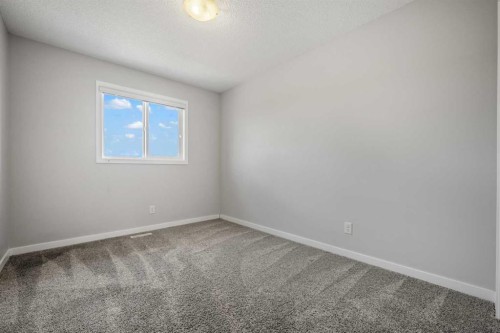 244 Sundown View, Cochrane, AB - Indoor Photo Showing Other Room