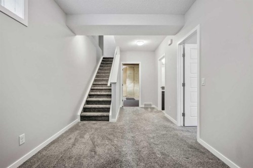 244 Sundown View, Cochrane, AB - Indoor Photo Showing Other Room