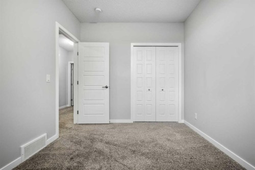 244 Sundown View, Cochrane, AB - Indoor Photo Showing Other Room