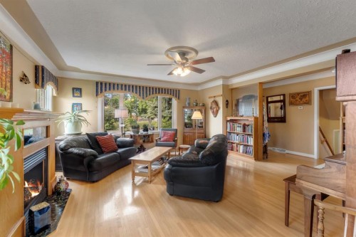 2204 Halifax Crescent Nw, Calgary, AB - Indoor Photo Showing Living Room With Fireplace