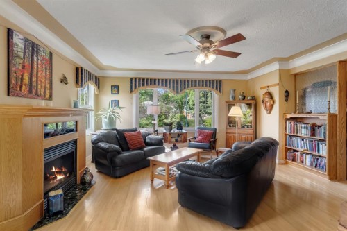 2204 Halifax Crescent Nw, Calgary, AB - Indoor Photo Showing Living Room With Fireplace