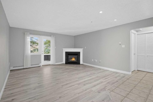 116-790 Kingsmere Crescent Sw, Calgary, AB - Indoor Photo Showing Living Room With Fireplace