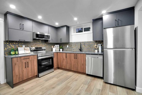 4916 Norquay Drive Nw, Calgary, AB - Indoor Photo Showing Kitchen With Stainless Steel Kitchen