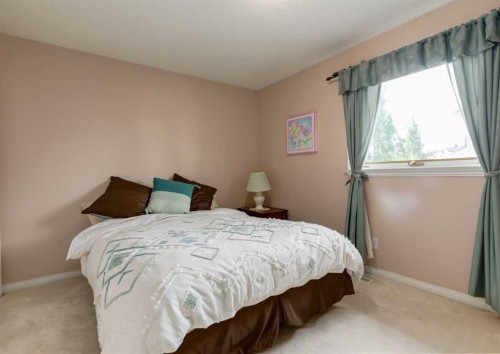 63 Arbour Lake Drive Nw, Calgary, AB - Indoor Photo Showing Bedroom