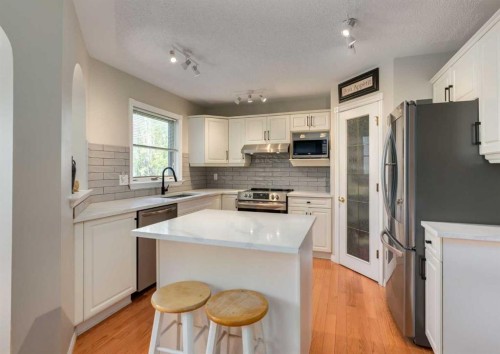 63 Arbour Lake Drive Nw, Calgary, AB - Indoor Photo Showing Kitchen With Stainless Steel Kitchen With Upgraded Kitchen