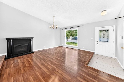 8 Hawkfield Crescent Nw, Calgary, AB - Indoor Photo Showing Living Room With Fireplace