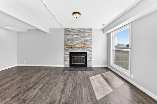 8 Hawkfield Crescent Nw, Calgary, AB - Indoor Photo Showing Living Room With Fireplace