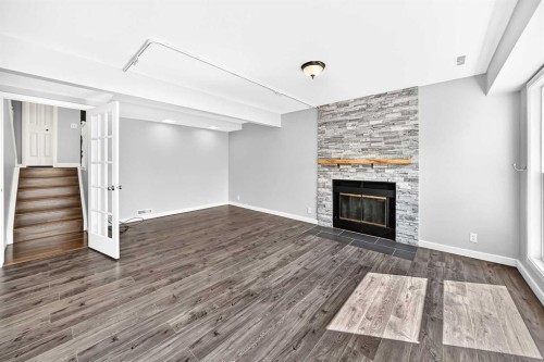 8 Hawkfield Crescent Nw, Calgary, AB - Indoor Photo Showing Living Room With Fireplace