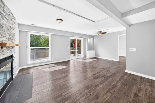 8 Hawkfield Crescent Nw, Calgary, AB - Indoor Photo Showing Living Room With Fireplace