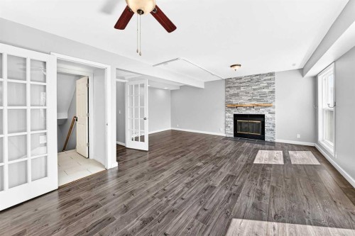 8 Hawkfield Crescent Nw, Calgary, AB - Indoor Photo Showing Living Room With Fireplace