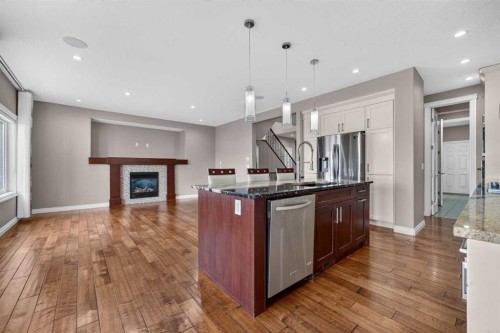 148 Evansborough Way Nw, Calgary, AB - Indoor Photo Showing Kitchen With Fireplace With Upgraded Kitchen