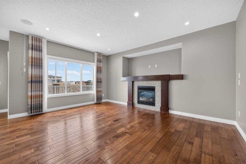 148 Evansborough Way Nw, Calgary, AB - Indoor Photo Showing Living Room With Fireplace