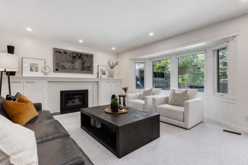 191 Canterville Drive Sw, Calgary, AB - Indoor Photo Showing Living Room With Fireplace