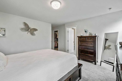 100 Cranbrook Gardens West, Calgary, AB - Indoor Photo Showing Bedroom