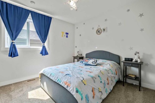 100 Cranbrook Gardens West, Calgary, AB - Indoor Photo Showing Bedroom