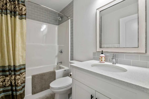100 Cranbrook Gardens West, Calgary, AB - Indoor Photo Showing Bathroom