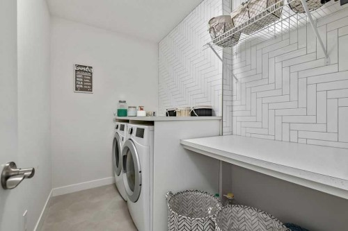 100 Cranbrook Gardens West, Calgary, AB - Indoor Photo Showing Laundry Room