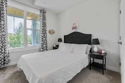 100 Cranbrook Gardens West, Calgary, AB - Indoor Photo Showing Bedroom