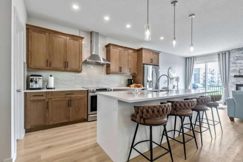100 Cranbrook Gardens West, Calgary, AB - Indoor Photo Showing Kitchen With Upgraded Kitchen