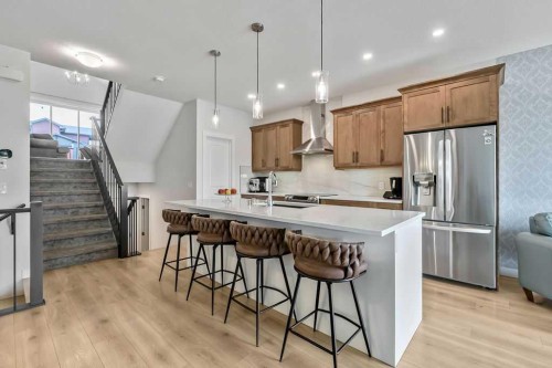 100 Cranbrook Gardens West, Calgary, AB - Indoor Photo Showing Kitchen With Stainless Steel Kitchen With Upgraded Kitchen