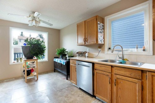 127 Shawinigan Drive Sw, Calgary, AB - Indoor Photo Showing Kitchen With Double Sink