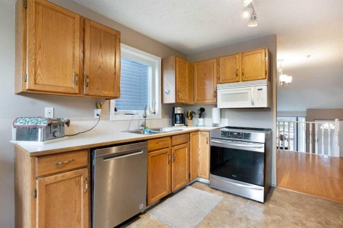 127 Shawinigan Drive Sw, Calgary, AB - Indoor Photo Showing Kitchen With Double Sink