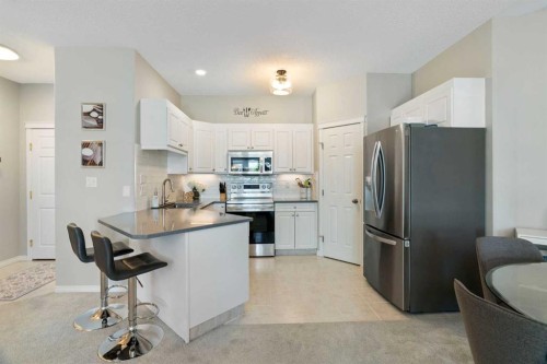 1301-7451 Springbank Boulevard Sw, Calgary, AB - Indoor Photo Showing Kitchen With Upgraded Kitchen