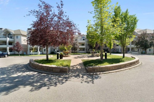 1301-7451 Springbank Boulevard Sw, Calgary, AB - Outdoor With Balcony With Facade