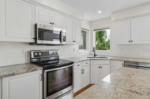74 Spring View Sw, Calgary, AB - Indoor Photo Showing Kitchen With Stainless Steel Kitchen