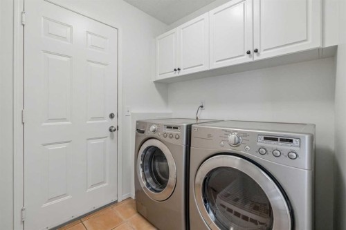 74 Spring View Sw, Calgary, AB - Indoor Photo Showing Laundry Room