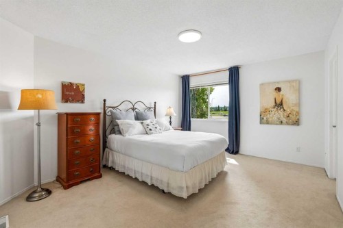 74 Spring View Sw, Calgary, AB - Indoor Photo Showing Bedroom