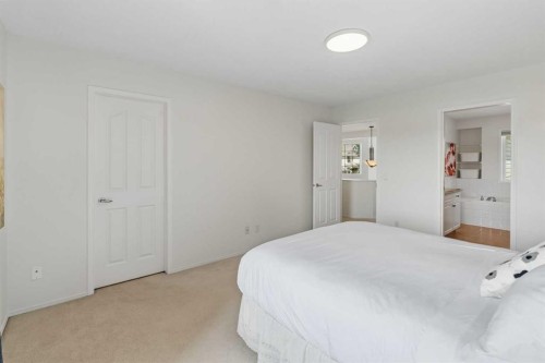 74 Spring View Sw, Calgary, AB - Indoor Photo Showing Bedroom