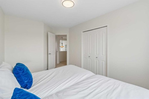 74 Spring View Sw, Calgary, AB - Indoor Photo Showing Bedroom