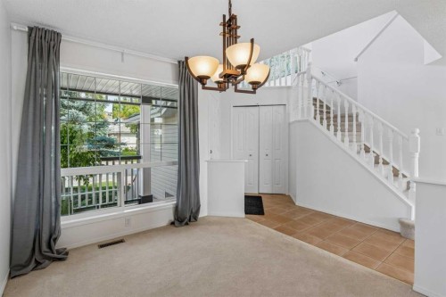 74 Spring View Sw, Calgary, AB - Indoor Photo Showing Other Room