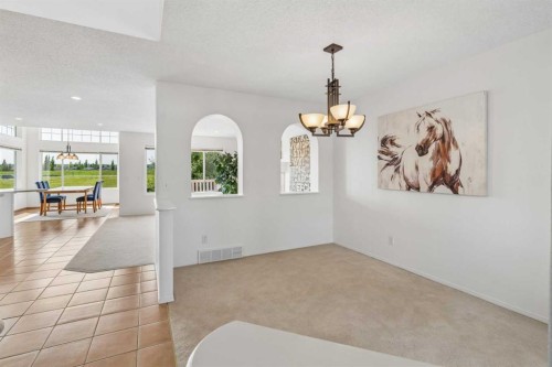 74 Spring View Sw, Calgary, AB - Indoor Photo Showing Other Room
