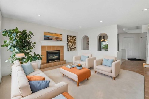 74 Spring View Sw, Calgary, AB - Indoor Photo Showing Living Room With Fireplace