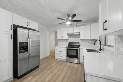 711 118 Avenue Sw, Calgary, AB - Indoor Photo Showing Kitchen With Double Sink With Upgraded Kitchen