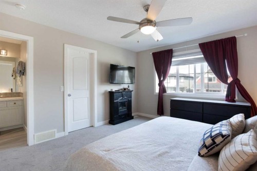 7 Emberside Hollow, Cochrane, AB - Indoor Photo Showing Bedroom