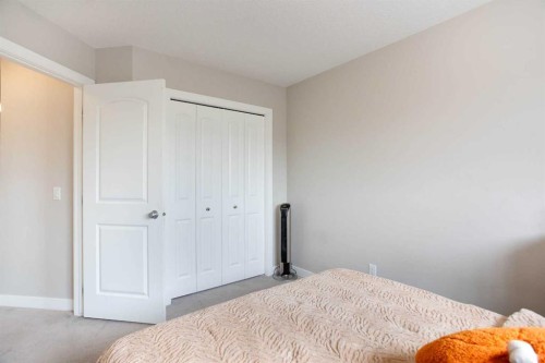 7 Emberside Hollow, Cochrane, AB - Indoor Photo Showing Bedroom