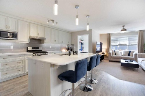 7 Emberside Hollow, Cochrane, AB - Indoor Photo Showing Kitchen With Upgraded Kitchen