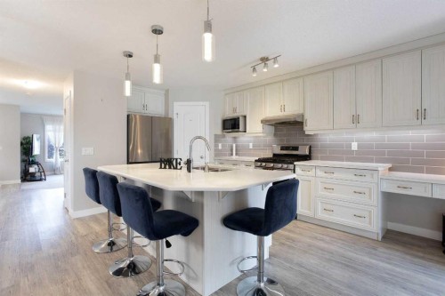 7 Emberside Hollow, Cochrane, AB - Indoor Photo Showing Kitchen With Upgraded Kitchen