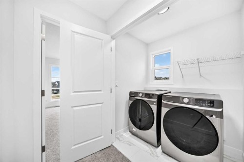 344 Herron Landing Ne, Calgary, AB - Indoor Photo Showing Laundry Room
