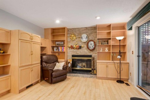 660 Coach Grove Road Sw, Calgary, AB - Indoor With Fireplace