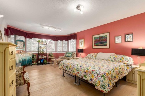 660 Coach Grove Road Sw, Calgary, AB - Indoor Photo Showing Bedroom