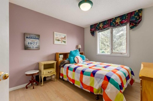 660 Coach Grove Road Sw, Calgary, AB - Indoor Photo Showing Bedroom