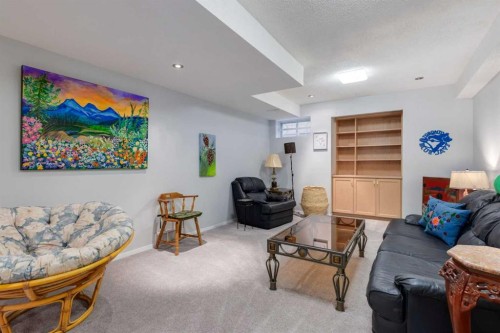 660 Coach Grove Road Sw, Calgary, AB - Indoor Photo Showing Living Room