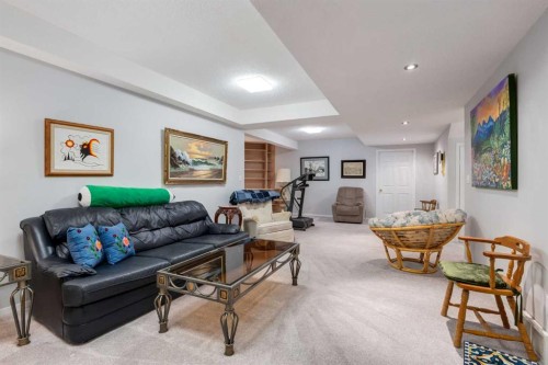 660 Coach Grove Road Sw, Calgary, AB - Indoor Photo Showing Living Room