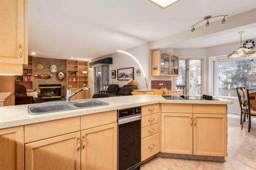 660 Coach Grove Road Sw, Calgary, AB - Indoor Photo Showing Kitchen With Double Sink